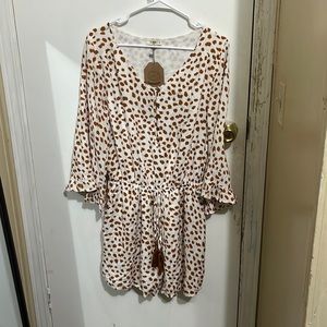 Brand new romper never been worn.Size small but fits like a medium brand Kori.